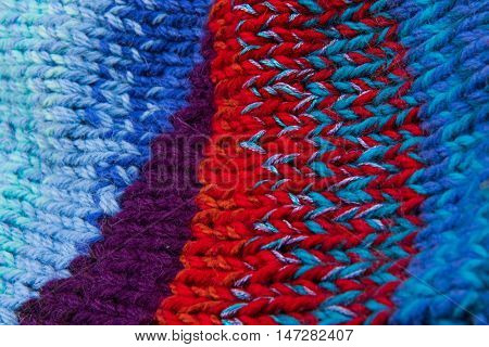 striped colorful wool texture handmade patten closeup macro blue red purple