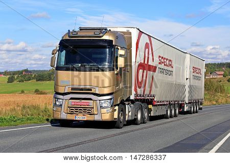 SALO, FINLAND - SEPTEMBER 11, 2016: Renault Trucks T and full trailer of Ahola Special Transport trucking along scenic road in South of Finland.