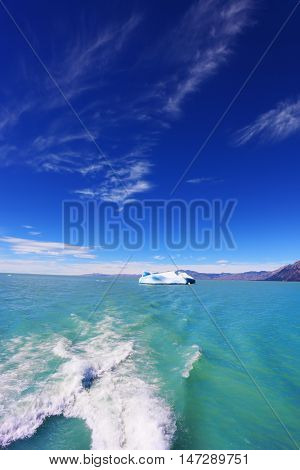 Unique lake Viedma in Argentine Patagonia. Excursion by boat on a cold lake waters to a huge iceberg.