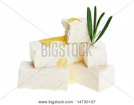 Feta ost kuber med rosmarin kvist og olie dråber