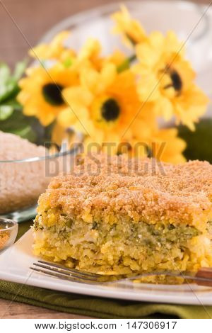 Rice timbale with zucchini on white dish.