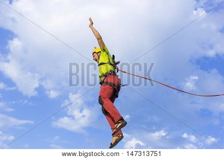 The first jump off the cliff with a safety rope.