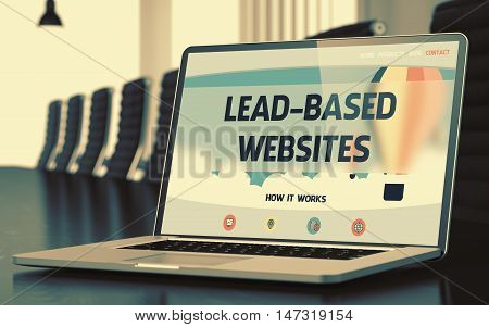 Modern Conference Hall with Laptop Showing Landing Page with Text Lead-based Websites. Closeup View. Blurred Image. Selective focus. 3D Render.