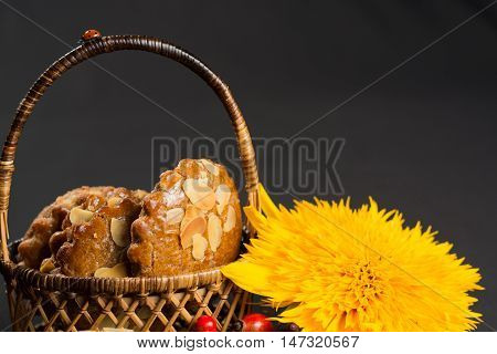 Typical Dutch filled spicy cookies with almonds on autumn colored and dark background