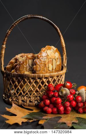 Typical Dutch filled spicy cookies with almonds on autumn colored and dark background