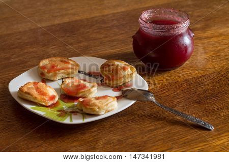 Olady (traditional ukrainian pancakes) with strawberry jam.