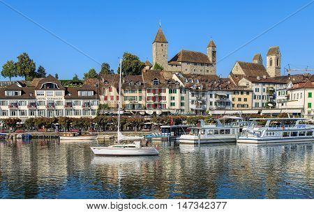 Rapperswil, Switzerland - 12 September, 2016: boats on Lake Zurich with historic buildings in the background. Rapperswil  is a part of the municipality of Rapperswil-Jona in the Swiss canton of St. Gallen, located on the east side of Lake Zurich.