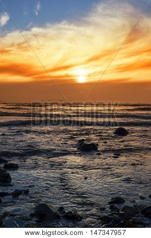 reflections at rocky beal beach near ballybunion on the wild atlantic way ireland with a beautiful yellow sunset