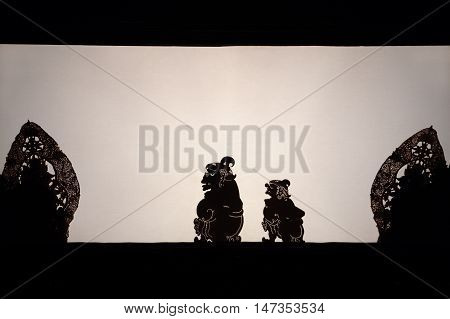 Bali Indonesia - 27 June 2016: Black shadow silhouette of old traditional puppets of Bali Island - Wayang Kulit. Culture religion Arts festival of Balinese and Indonesian people. Travel background