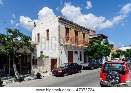 PALEOCHORA, CRETE, GREECE - JUNE 2016: Street of Paleochora town with parked  cars on Crete island, Greece
