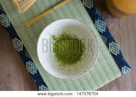 Japanese Matcha green tea powder in a chawan or traditional ceramic bowl shallow focus