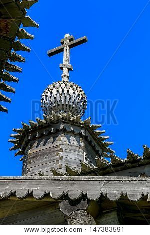 Old wooden Church in the village in the summer