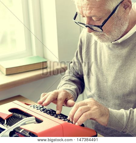 Senior Adult Typing Typewriter Concept