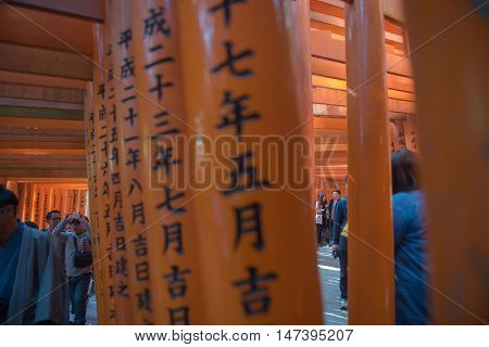 KYOTO, JAPAN - APRIL 30 , 2016 : Torii gates in Fushimi Inari Shrine, Kyoto, Japan. APRIL 30 2016. walkway in Torii gates.