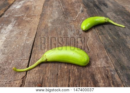 green eggplant. Fresh veggies on a wooden table. (Solanum melongena ) : Select focus front  with shallow depth of field. and copy space.