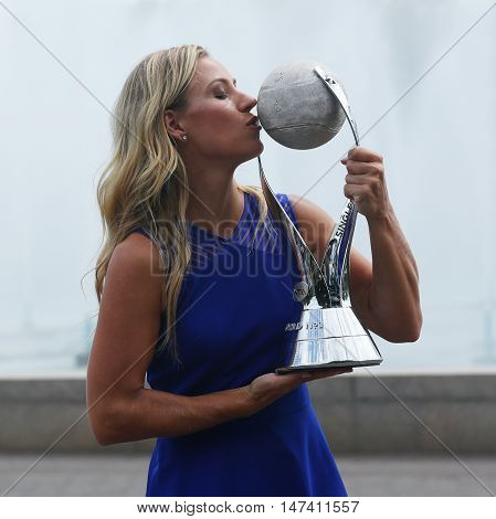 NEW YORK - SEPTEMBER 11, 2016: Two times Grand Slam champion Angelique Kerber of Germany poses with the WTA No.1 trophy  after her victory at US Open 2016 at Billie Jean King National Tennis Center