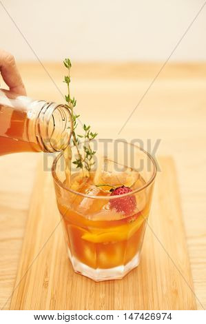 This Easy Peach and Strawberry iced Tea is the perfect drink recipe for grilling out on sunny days with friends. It's so refreshing and you will love the chunks of fresh fruit.