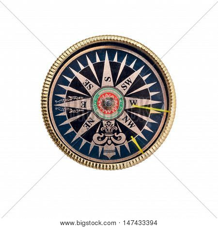 Antique golden Compass isolated on white indicating the points of the compass
