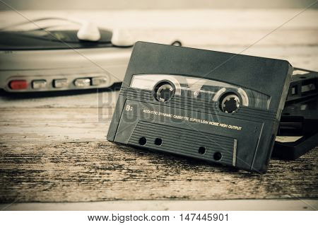 Old casette tape player. Retro style photo on wooden background