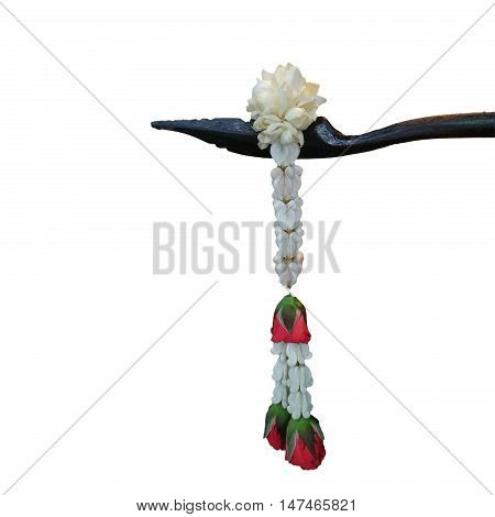 Jasmine garland looped end of the dipper handle on white background
