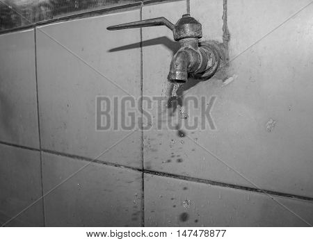 Water drop from faucet. Draks pure, faucet, ecology, background