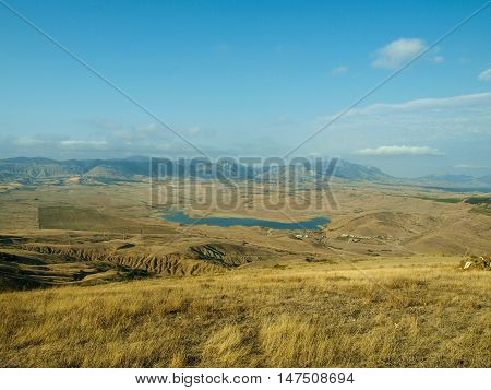 Picturesque view from the hill to the lake Bugaz and mountains in Crimea
