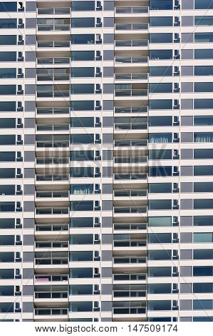 Repeating pattern of windows on new modern apartment building.