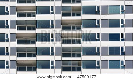 Repeating pattern of windows on new modern apartment building.