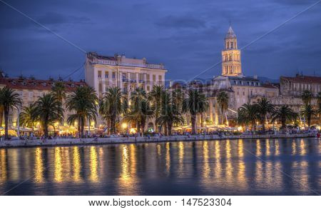 Nighttime view on Riva waterfront, houses and Cathedral of Saint Domnius, Dujam, Duje, bell tower in old town, Split, Croatia, HDR