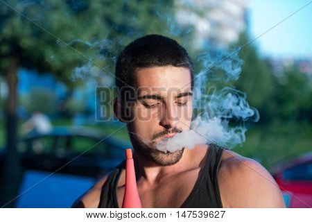 Man Smoking Shisha Outdoor
