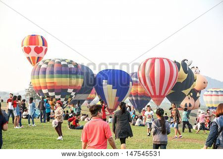 CHIANGRAI THAILAND - FEBRUARY 15 2016 : Hot air Balloons ready to rise into the sky in the morning at SINGHA PARK CHIANGRAI BALLOON FIESTA 2016 Chiangrai province Thailand