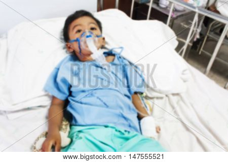 blurry of boy sick in inhaler mask for kid the hopital