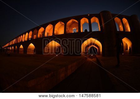 sunset time to historical stone bridge of 33 arches in isfahan, iran at September 15, 2016.