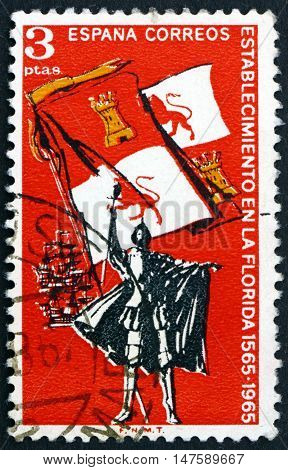 SPAIN - CIRCA 1965: a stamp printed in Spain shows Explorer Royal Flag of Spain and Ships 400th Anniversary of the Settlement of Florida circa 1965