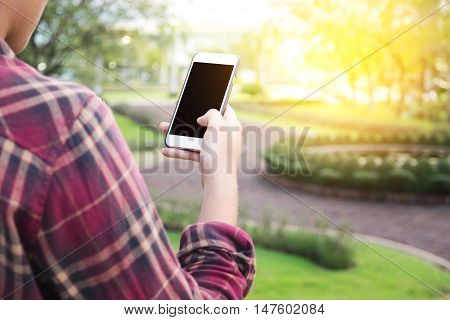 Man holding and showing smartphone screen .vintage tone