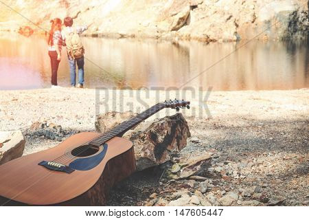 Close up guitar Behind the romantic couple travelers concept