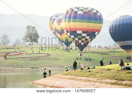 CHIANGRAI THAILAND - FEBRUARY 14 : Hot air Balloons ready to rise into the sky in the morning at SINGHA PARK CHIANGRAI BALLOON FIESTA 2016 Chiangrai province Thailand