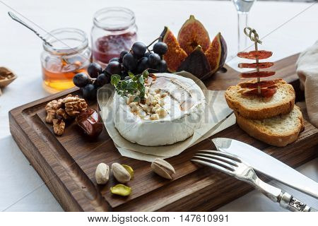Baked Camambert Cheese With Jam Decorated  Almond