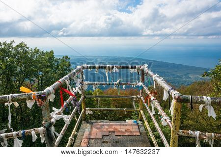 An observation deck at a height of 1005 meters Gagra Abkhazia. Colorful memorial ribbons are tied on the railing.