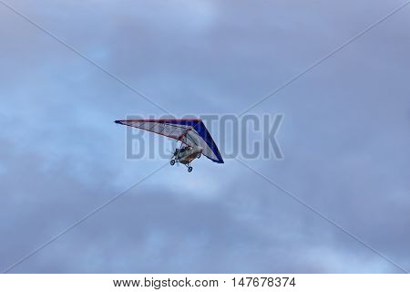 trike on a background of clouds in the evening sky