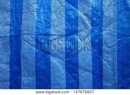 closeup blue and white bags of fertilizer