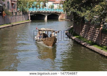 ESKISEHIR TURKEY - SEPTEMBER 04 2016: People in Gondola tour in Porsuk river. Porsuk river is one of the most populer touristy place with boat tours and entertainment in Eskisehir.