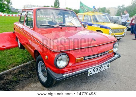 Kharkiv Ukraine - May 22 2016: Soviet retro car red ZAZ-968M is presented at the festival of vintage cars Kharkiv Retro Rally - 2016 in Kharkiv Ukraine on May 22 2016
