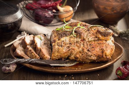 Sliced roasted pork with spices rustic style