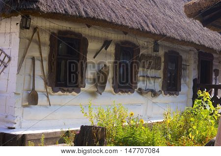 White Timbered Wall with Wooden Windows of Vintage Rural House