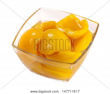 Tinned peach compote isolated on white background