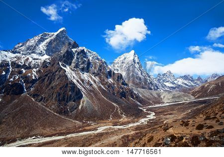 Cholatse (also known as Jobo Lhaptshan) and Taboche peaks view - mountain landscape in Sagarmatha National Park, Nepal.