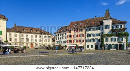 Rapperswil, Switzerland - September 12, 2016: people and historic buildings on Fischmarktplatz square. Rapperswil is a part of the municipality of Rapperswil-Jona in the Swiss canton of St. Gallen, located on the east side of Lake Zurich.