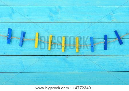 Nine clips on wooden wall