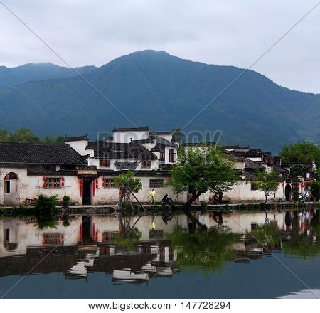 HONGCUN, CHINA - APRIL 20, 2014: Moon Lake in historical Hongcun Village, China.